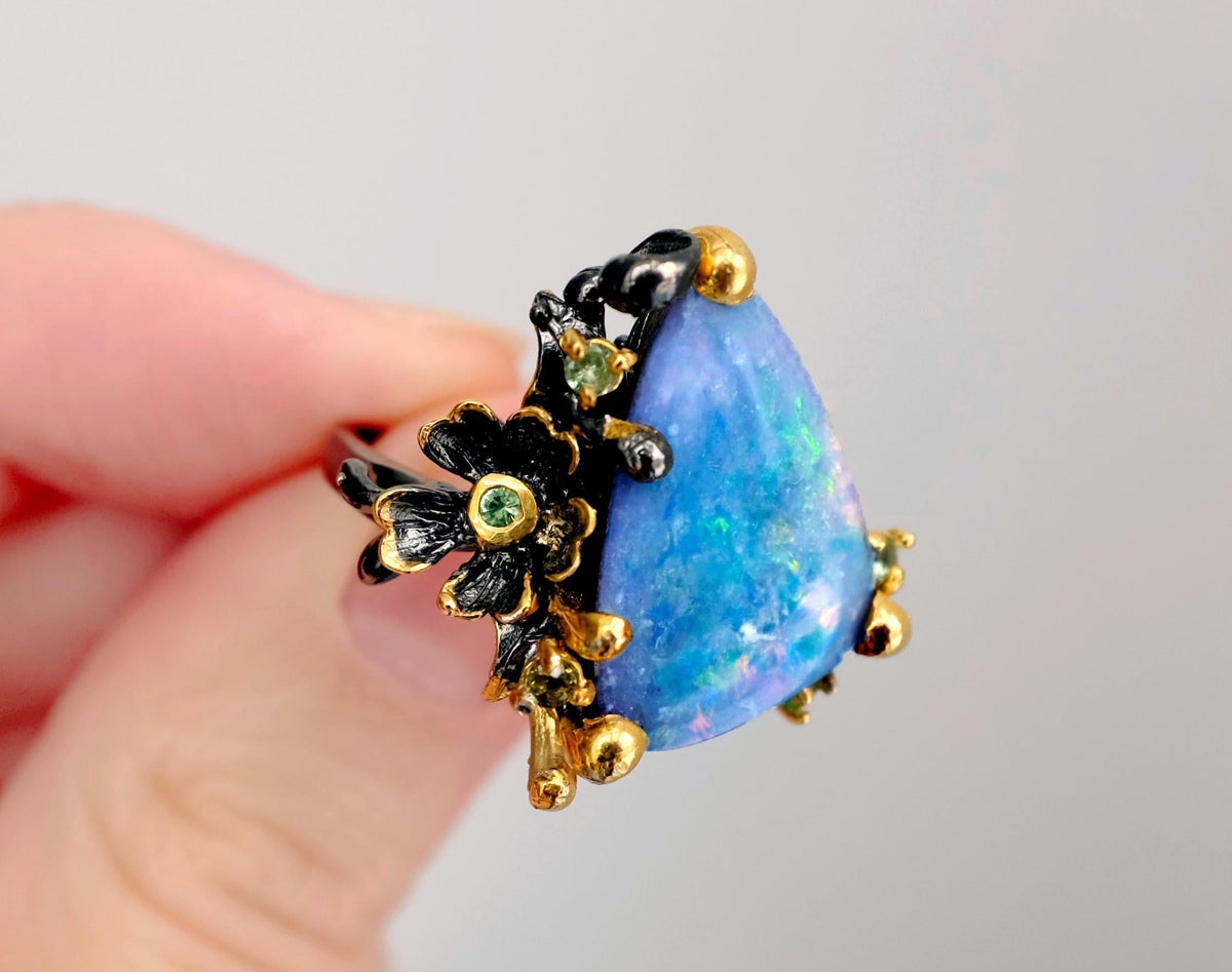 925 Sterling Silver Boulder Opal Ring with flower making a statement piece, shown by hand 