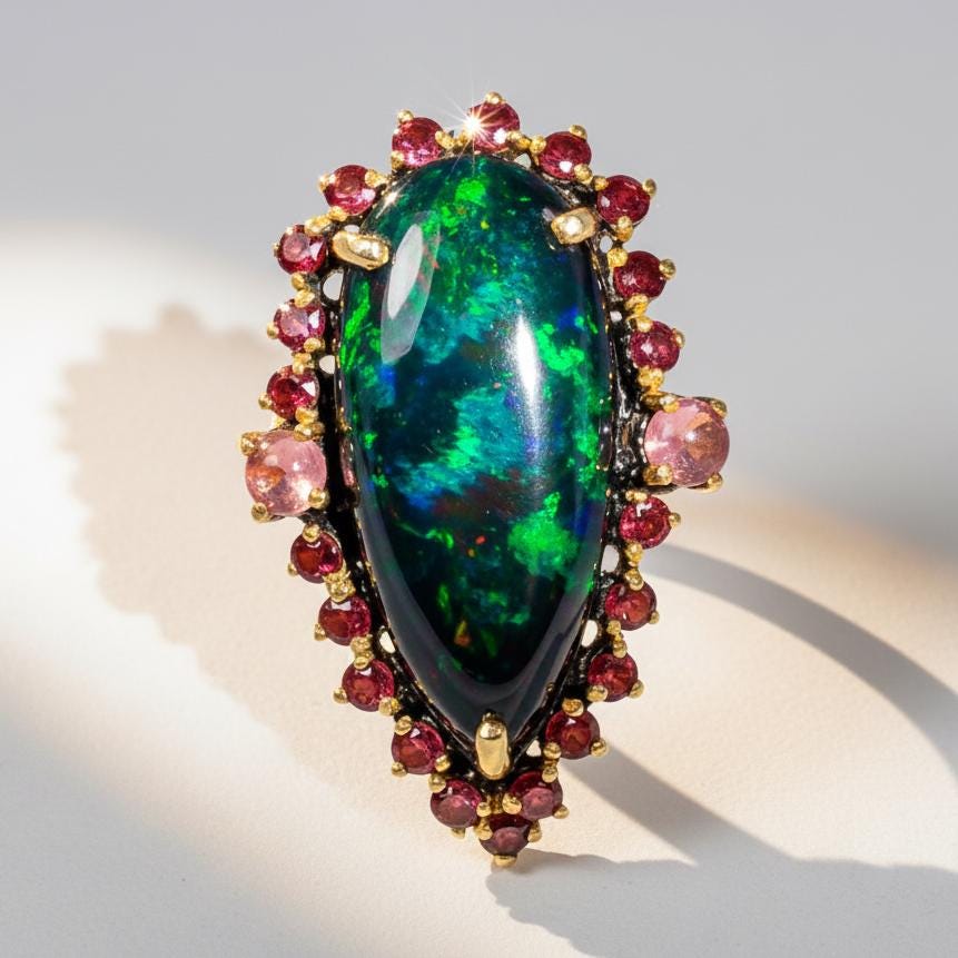 Black Opal Pear Ring, worn on hand