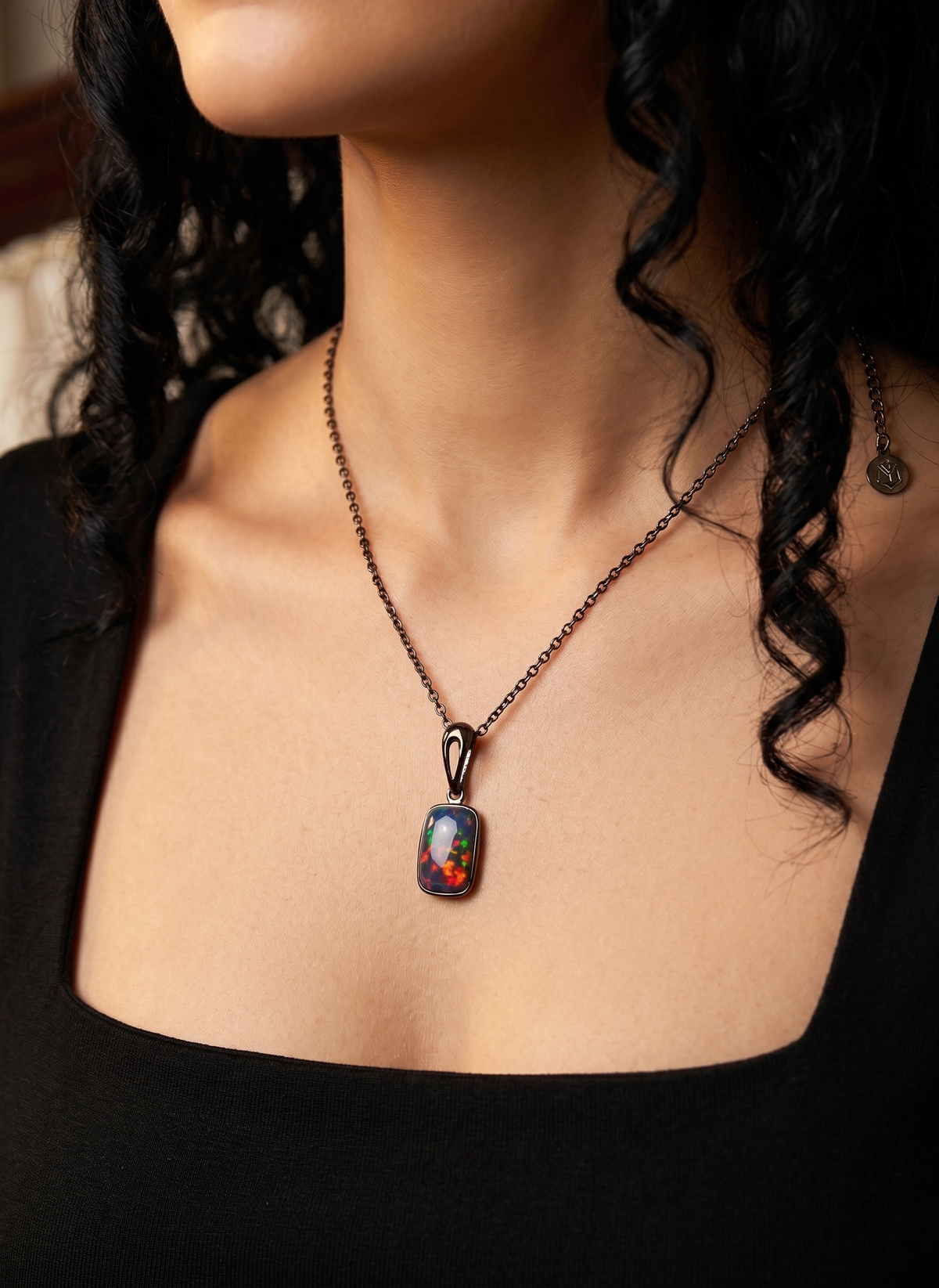 Necklace with a pendant worn by a model