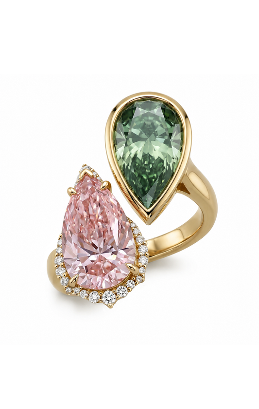 18K solid gold ring featuring a large pear-cut pink diamond and a smaller pear-cut green diamond, both surrounded by small clear accent stones, set against a plain white background